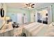 This relaxing bedroom features lots of natural light, a dresser, and an armchair overlooking a patio at 408 Delwood Breck St, Ruskin, FL 33570
