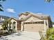 Beautiful home featuring well-kept landscaping, a two-car garage, and a concrete driveway at 408 Delwood Breck St, Ruskin, FL 33570