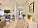 Long foyer features a nautical theme with light hardwood floors and plenty of natural light at 408 Delwood Breck St, Ruskin, FL 33570