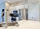 Modern kitchen with stainless steel appliances, white cabinets, tile backsplash, and quartz countertop at 408 Delwood Breck St, Ruskin, FL 33570