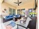 Covered lanai area with an outdoor kitchen that adjoins a dining and conversation area at 408 Delwood Breck St, Ruskin, FL 33570
