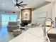 Inviting living room features a stone fireplace, comfortable seating, and a neutral color palette at 408 Delwood Breck St, Ruskin, FL 33570