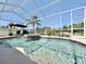 Sparkling pool with spa, surrounded by a screened lanai for outdoor enjoyment at 408 Delwood Breck St, Ruskin, FL 33570