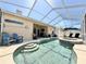 The swimming pool and hot tub connect to the outdoor patio sitting and lounge area at 408 Delwood Breck St, Ruskin, FL 33570