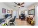 Bright office featuring a ceiling fan, wooden floors, multiple computer monitors, and plenty of space to get things done at 4116 W Watrous Ave, Tampa, FL 33629