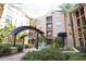 Community courtyard featuring a fountain, lush greenery, and relaxing seating areas for residents to enjoy at 4221 W Spruce St # 2422, Tampa, FL 33607