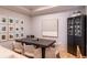 Formal dining area features a large table, elegant seating, and curated artwork at 4221 W Spruce St # 2422, Tampa, FL 33607