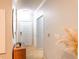 Inviting hallway with wood-look floors, offering access to various rooms within the home at 4221 W Spruce St # 2422, Tampa, FL 33607