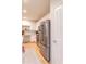 Bright, updated kitchen featuring stainless steel appliances, white cabinetry, and wood-look flooring at 4221 W Spruce St # 2422, Tampa, FL 33607