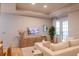 Bright living room featuring hardwood floors, recessed lighting, a modern tv and a comfortable couch at 4221 W Spruce St # 2422, Tampa, FL 33607