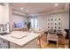 Open-concept living room features a modern kitchen, comfortable seating, and stylish decor at 4221 W Spruce St # 2422, Tampa, FL 33607