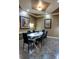 Intimate meeting room with a large oval table, seating for six, and tasteful wall art at 4221 W Spruce St # 2422, Tampa, FL 33607