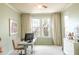 Bright home office features a large window, comfortable workspace, and natural light at 4221 W Spruce St # 2422, Tampa, FL 33607