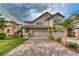 Stunning two-story home with a paver driveway and three-car garage, perfect for Gathering living at 4689 Wandering Way, Wesley Chapel, FL 33544