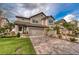 Stunning two-story home featuring a three-car garage, well manicured lawn, and beautiful landscaping at 4689 Wandering Way, Wesley Chapel, FL 33544