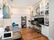 Stylish home office featuring built-in shelving, a comfortable daybed, and modern decor at 4689 Wandering Way, Wesley Chapel, FL 33544