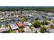 An aerial view shows a waterfront community with docks, boatlifts, and beautiful landscaping at 4920 Pelican Dr, New Port Richey, FL 34652