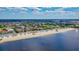 Picturesque aerial view of a coastal community, sandy beach and waterfront canal homes at 4920 Pelican Dr, New Port Richey, FL 34652