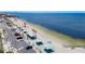 Serene beach with covered picnic areas and parking spaces, perfect for waterfront living at 4920 Pelican Dr, New Port Richey, FL 34652