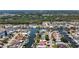 Beautiful aerial view of the neighborhood with canal access and mature trees at 4920 Pelican Dr, New Port Richey, FL 34652