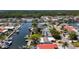 An aerial view showcasing the waterfront homes and canal system at 4920 Pelican Dr, New Port Richey, FL 34652