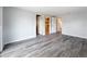 Spacious bedroom features wood-look floors and multiple closets, providing ample storage space at 4920 Pelican Dr, New Port Richey, FL 34652