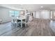 Dining table with seating for six located near the kitchen and front entrance at 4920 Pelican Dr, New Port Richey, FL 34652