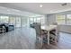 Open concept living area with dining table and view of the waterway at 4920 Pelican Dr, New Port Richey, FL 34652