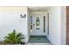 Elegant front entrance features a decorative glass door and tiled entryway at 4920 Pelican Dr, New Port Richey, FL 34652