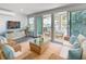 Cozy living room with wicker furniture and view of the waterfront at 4920 Pelican Dr, New Port Richey, FL 34652