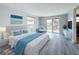 This bright main bedroom with outside access is furnished with a comfortable king bed at 4920 Pelican Dr, New Port Richey, FL 34652