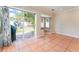 Open dining area with sliding glass door to backyard and window seat at 5607 Tanagergrove Way, Lithia, FL 33547