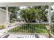 Inviting front porch view showcasing the neighborhood with lush greenery and beautiful homes at 5607 Tanagergrove Way, Lithia, FL 33547