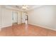 Spacious main bedroom with ceiling fan, tile flooring, and ensuite bathroom at 5607 Tanagergrove Way, Lithia, FL 33547