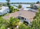 Beautiful aerial view showcasing the tile roof, landscaping and overall layout of the property at 5818 Cruiser Way, Tampa, FL 33615