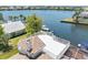 Breathtaking waterfront property showcasing the rooftop deck and boat dock at 5818 Cruiser Way, Tampa, FL 33615