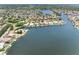 Expansive aerial view of waterfront properties, boasting lush landscaping and direct water access at 5818 Cruiser Way, Tampa, FL 33615