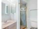 Bright bathroom featuring a vanity and a shower with a decorative glass door at 5818 Cruiser Way, Tampa, FL 33615