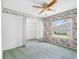 Bedroom featuring a closet, window and ceiling fan at 5818 Cruiser Way, Tampa, FL 33615