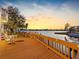 Spacious wooden deck offers a scenic waterfront view, perfect for outdoor entertaining and relaxation at 5818 Cruiser Way, Tampa, FL 33615