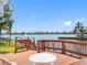 Waterfront deck area with a seating area and scenic views of the water at 5818 Cruiser Way, Tampa, FL 33615