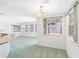 Dining room featuring natural lighting, a chandelier, and views of the pool at 5818 Cruiser Way, Tampa, FL 33615