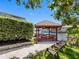 This waterfront property includes a cozy gazebo on the private dock with beautiful water views at 5818 Cruiser Way, Tampa, FL 33615