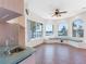 Kitchenette with tiled flooring, a built-in sink, and bay windows offering beautiful waterfront views at 5818 Cruiser Way, Tampa, FL 33615