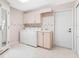Well-equipped laundry room with washer, dryer, cabinets, and convenient sink at 5818 Cruiser Way, Tampa, FL 33615