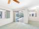 The living room offers views of the pool, as well as the screened-in patio with access to the pool at 5818 Cruiser Way, Tampa, FL 33615