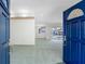 Open floor plan with view to the backyard; accessible through bright blue front doors at 5818 Cruiser Way, Tampa, FL 33615
