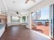 Bright living room showcasing tile flooring, a spiral staircase, and water views from sliding glass doors at 5818 Cruiser Way, Tampa, FL 33615