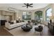 Modern living room with hardwood floors, lake view, and comfortable seating at 5818 Cruiser Way, Tampa, FL 33615