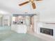 Bright, combined living room and kitchen featuring a fireplace at 5818 Cruiser Way, Tampa, FL 33615